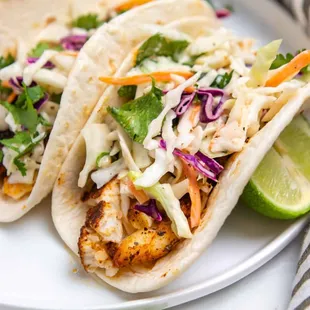 two fish tacos on a plate