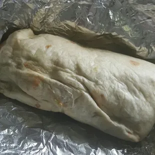 Chicken burrito. Everything on it inlcuded $5.99 Guac is extra at $1.50