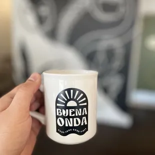 a person holding a coffee mug