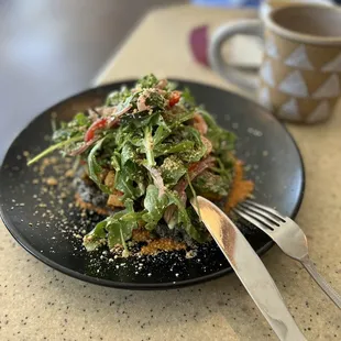 a plate of food and a cup of coffee