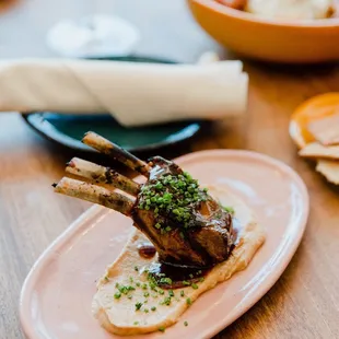 a plate of lamb chops