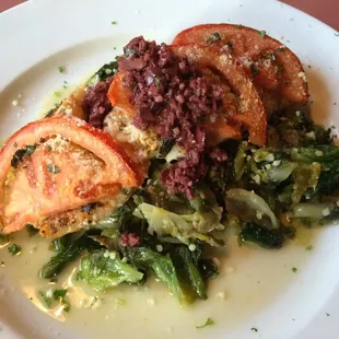 White fish, with greens, kalamata olives and tomatoes