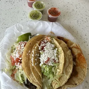 Left to right: steak taco with everything, chicken taco with everything, pastor taco with onions only. (No cilantro for all)