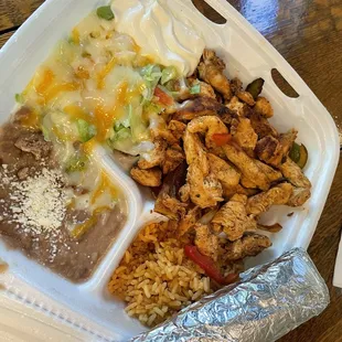 a meal in a styrofoam container