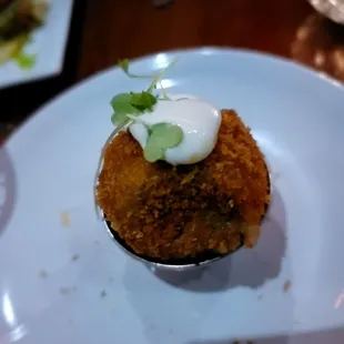 Blue Peruvian Potato. Fancy tasty Papa Rellena. 1 of 3 potatoes from plate
