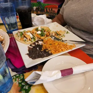 Chicken, soft taco platter with rice and black beans.