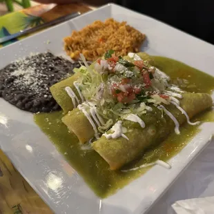 Chicken enchiladas with mild green verde sauce.