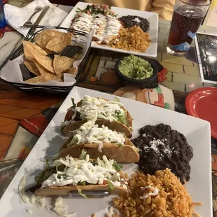 crunchy carnitas tacos, chorizo enchiladas, and Fresh Guacamole and Chips