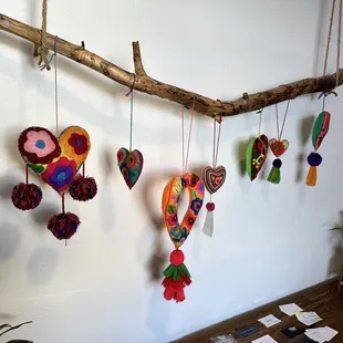 a branch with hearts hanging from it