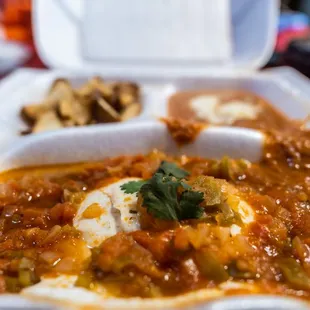a meal in a styrofoam container