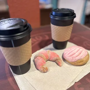 two donuts and a cup of coffee