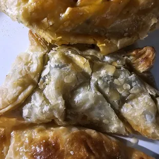 Asst empanadas to go. So yum! Came w/lrg portion chimichurri.