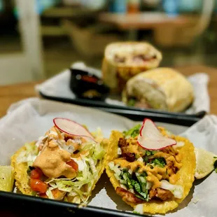 Tacos: fish &amp; chicken, Carne Asada burrito (pictured in the back)