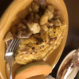 Chorizo omelette with a side of bacon.