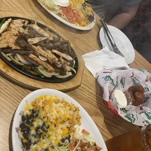 Combo dinner - burrito, enchilada, and tamale. Chick/steak fajitas that come with guac, pico,cheese, beans and rice. Stuffed tater tots