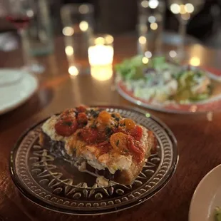 a slice of pizza on a plate