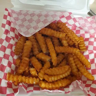 ows french fries in a styrofoam container