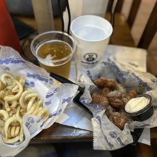 Fries, boneless wings and beer pint with complimentary cup