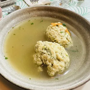 Bowl of matzoh bowl. Broth was kind of bland. The balls were very light and had a lot of dill.