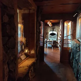 the interior of a restaurant with stone walls
