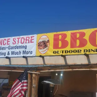 a bbq sign on the side of a building