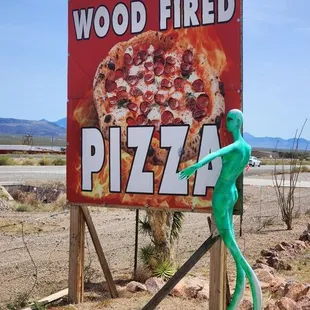 Aliens welcome you to the restaurant.