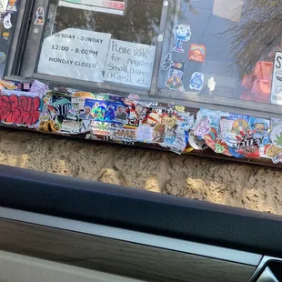 a window covered in stickers