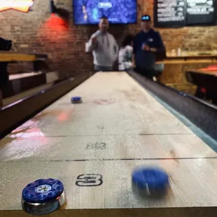 a shuffle table in a bar