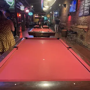 a pool table in a bar