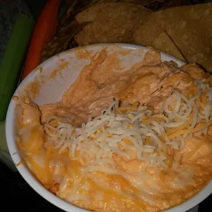 Buffalo chicken dip with tortilla chips that are too salty.