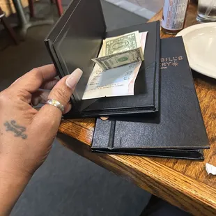 When she brought back my $1 she shorted me