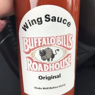 a hand holding a bottle