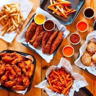 a variety of wings and fries