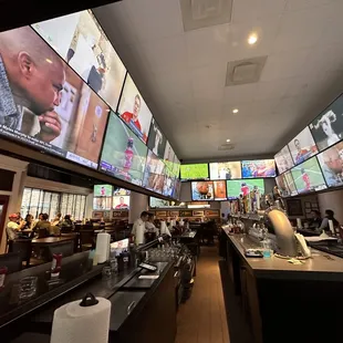 a bar with multiple screens