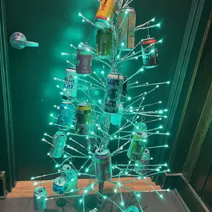 a christmas tree made out of cans