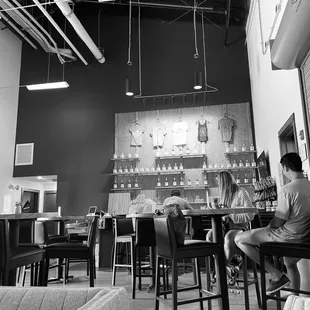 two people sitting at a bar