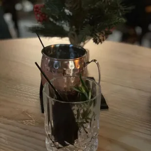 a shot of a glass with a plant in it
