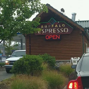 a car parked in front of a restaurant