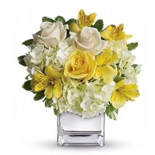 a bouquet of white and yellow flowers