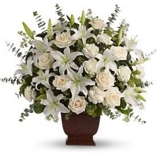 i ordered this arrangement BUT with color. Notice how many lilies are in the picture.