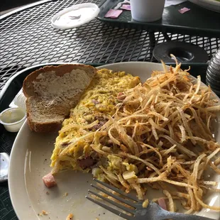 Omelette  crispy airy hash browns  rye toast