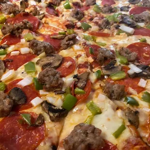 pepperoni, sausage, mushrooms, and peppers