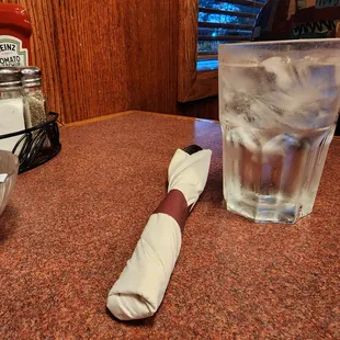 a glass of ice cream and a napkin