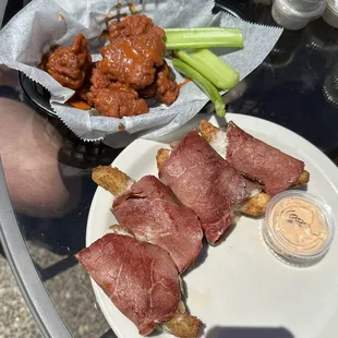 Buffalo wings and pickles in a blanket