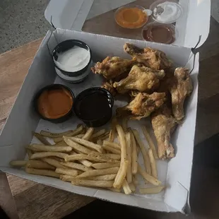 Chicken wings and fries