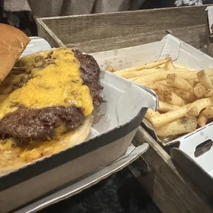 Two cheeseburgers with absolutely no toppings! What you don&apos; t see are the missing fried pickles and 20 wings!