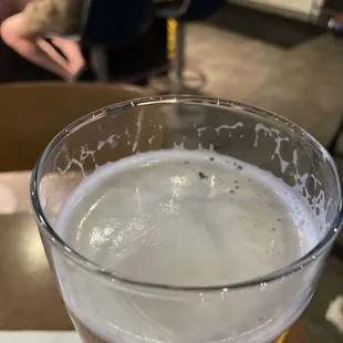 a glass of beer on a table