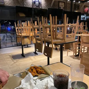 TVs off and chairs stacked 30 min prior to closing time.