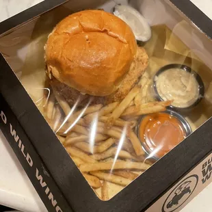 a burger and fries in a box