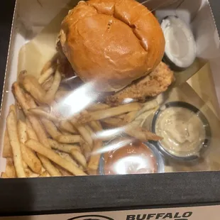 a burger and fries in a box